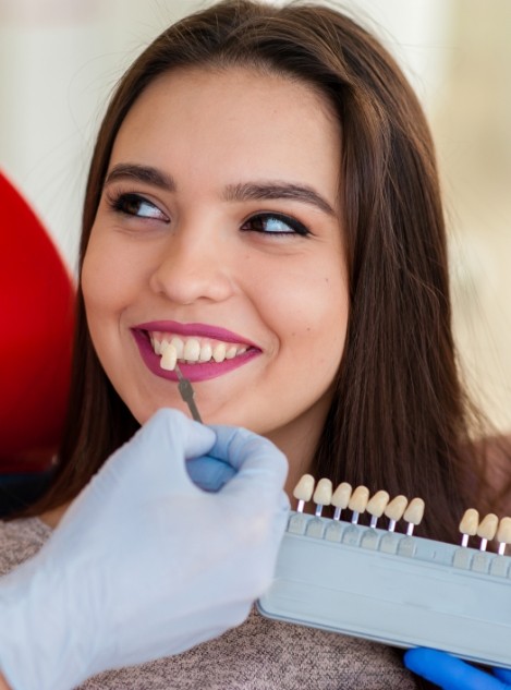 Young woman trying on dental veneers