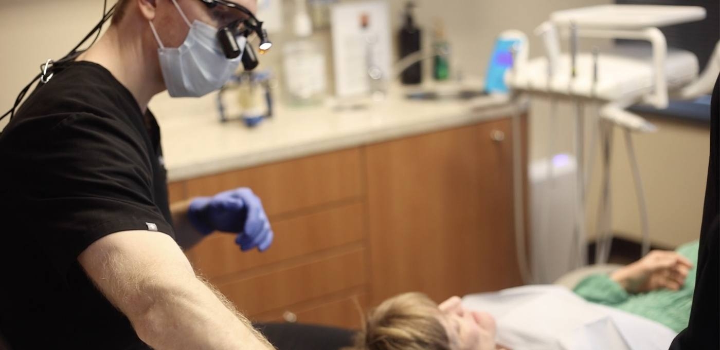 Doctor Vason giving a patient a dental checkup in Buckhead Atlanta Georgia