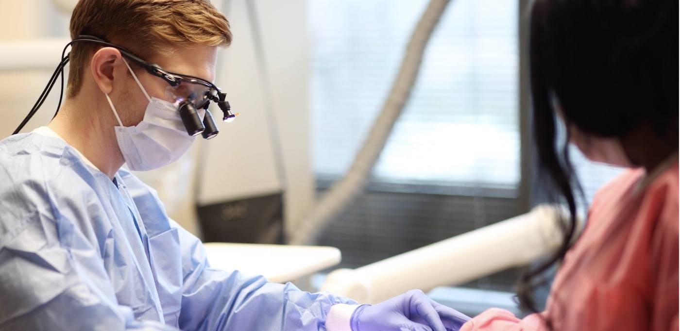 Doctor Carlisle Vason examining a dental patient