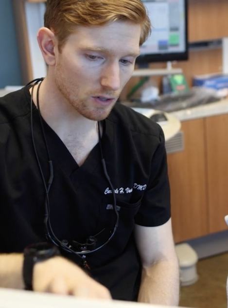 Doctor Vason talking to a dental patient