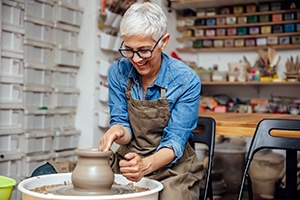 Woman smiling during pottery class