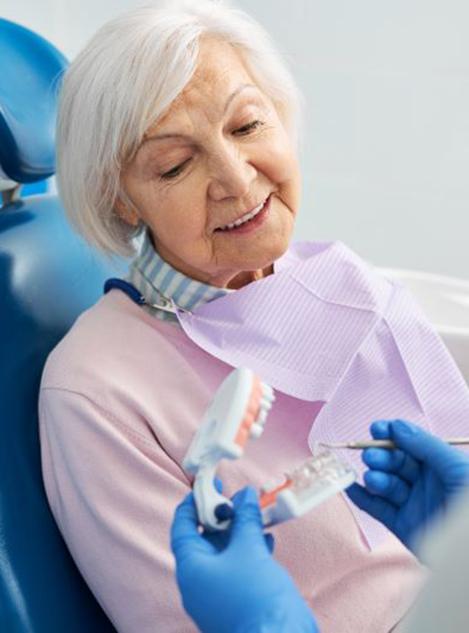 Senior patient talking to her dentist