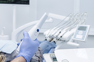 Holding scanner used for taking digital dental impressions
