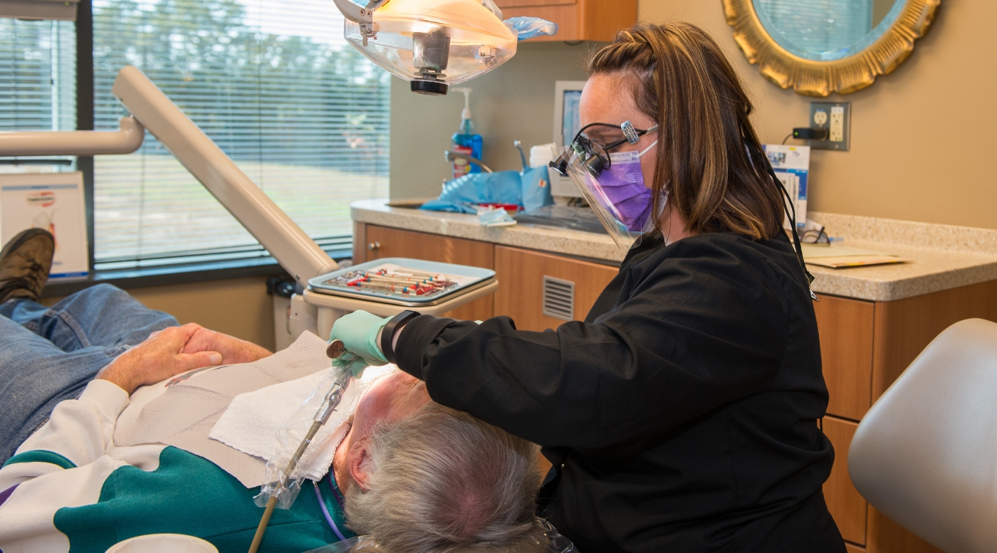 Buckhead Atlanta dental hygienist Dena giving a patient a teeth cleaning