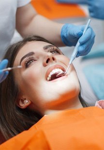 a patient undergoing a dental checkup and cleaning