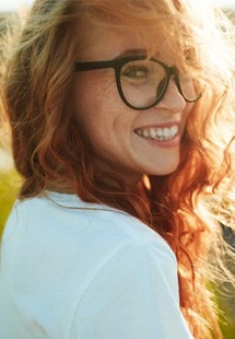 a woman smiling after repairing her smile