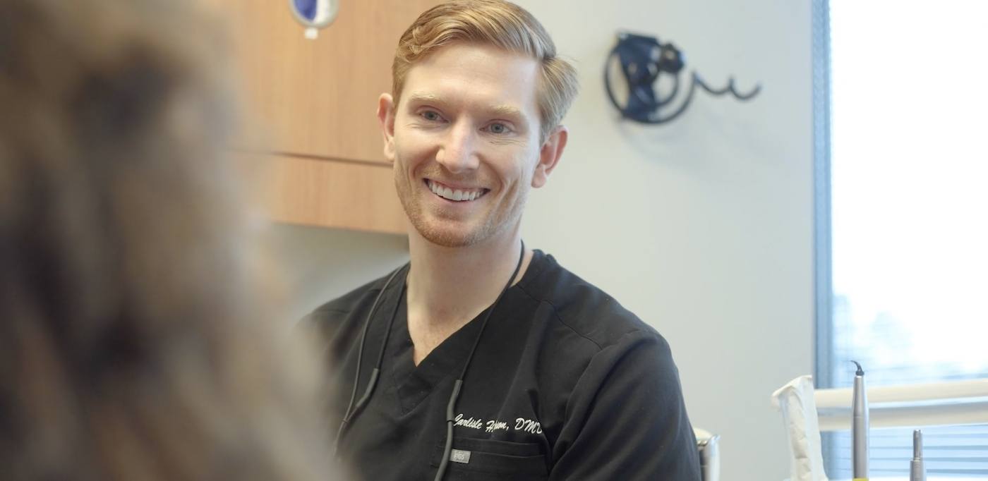 Atlanta Georgia dentist Doctor Carlisle Vason smiling at a dental patient