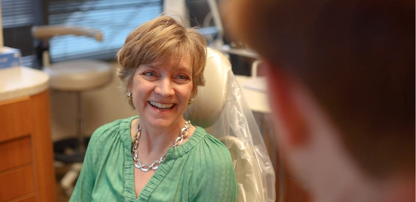 Woman smiling with her sedation dentist in Buckhead Atlanta