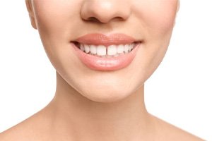 Woman’s smile with gap between the front teeth