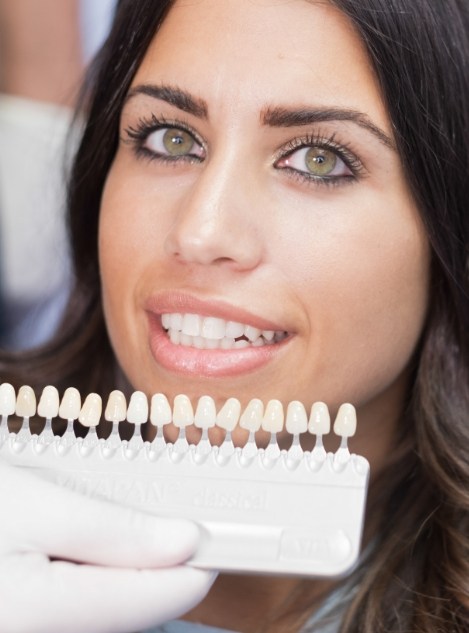 Woman trying on dental veneers in Atlanta