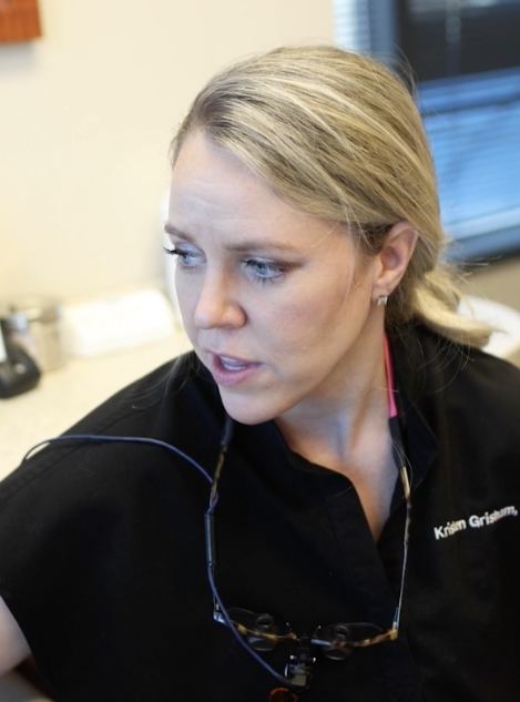 Doctor Grisham talking to a dental patient