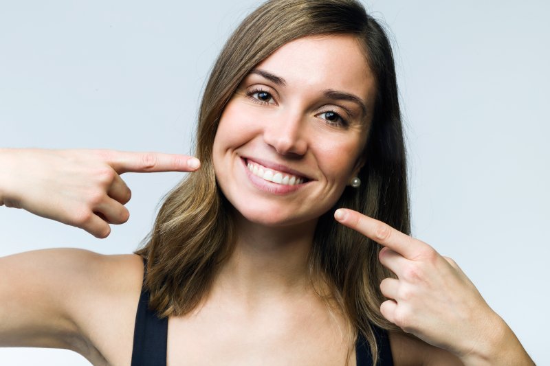 Woman smiling after cosmetic dentistry