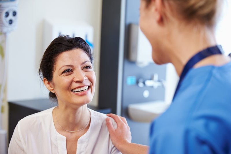 patient talking to their dentist