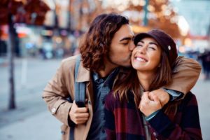 a happy couple showing their beautiful smiles