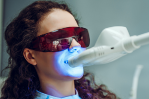 Woman having in-office teeth whitening