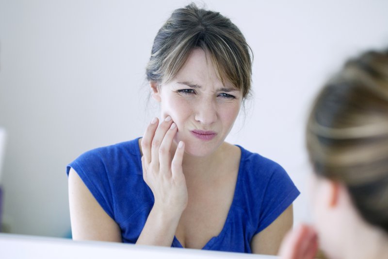 Woman with a sore jaw