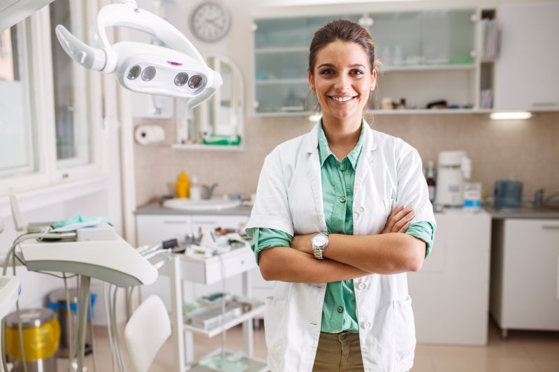 Dentist smiles in office