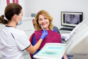 Older woman at her dental implant consultation